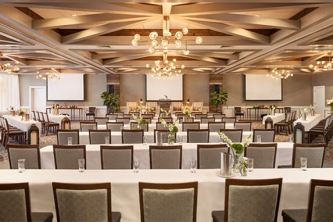 Chairs aligned in a classroom setup facing a podium at Gurney's Montauk Resort