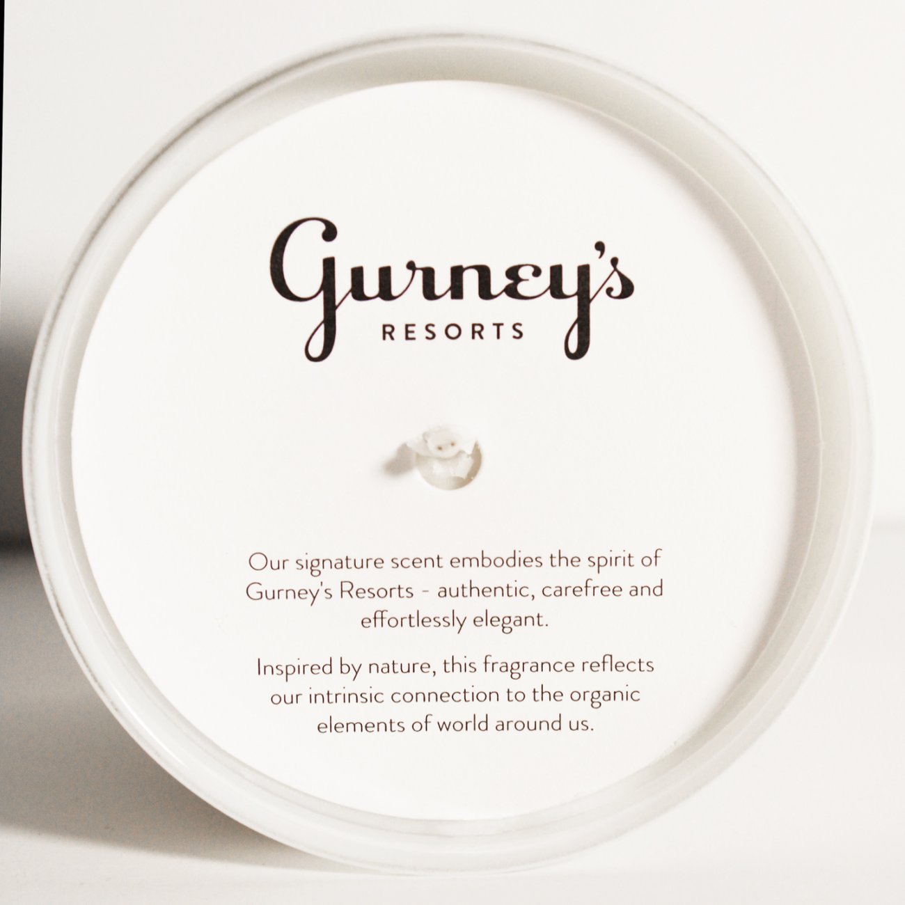 A top view of the Gurney's Resorts Signature Candle