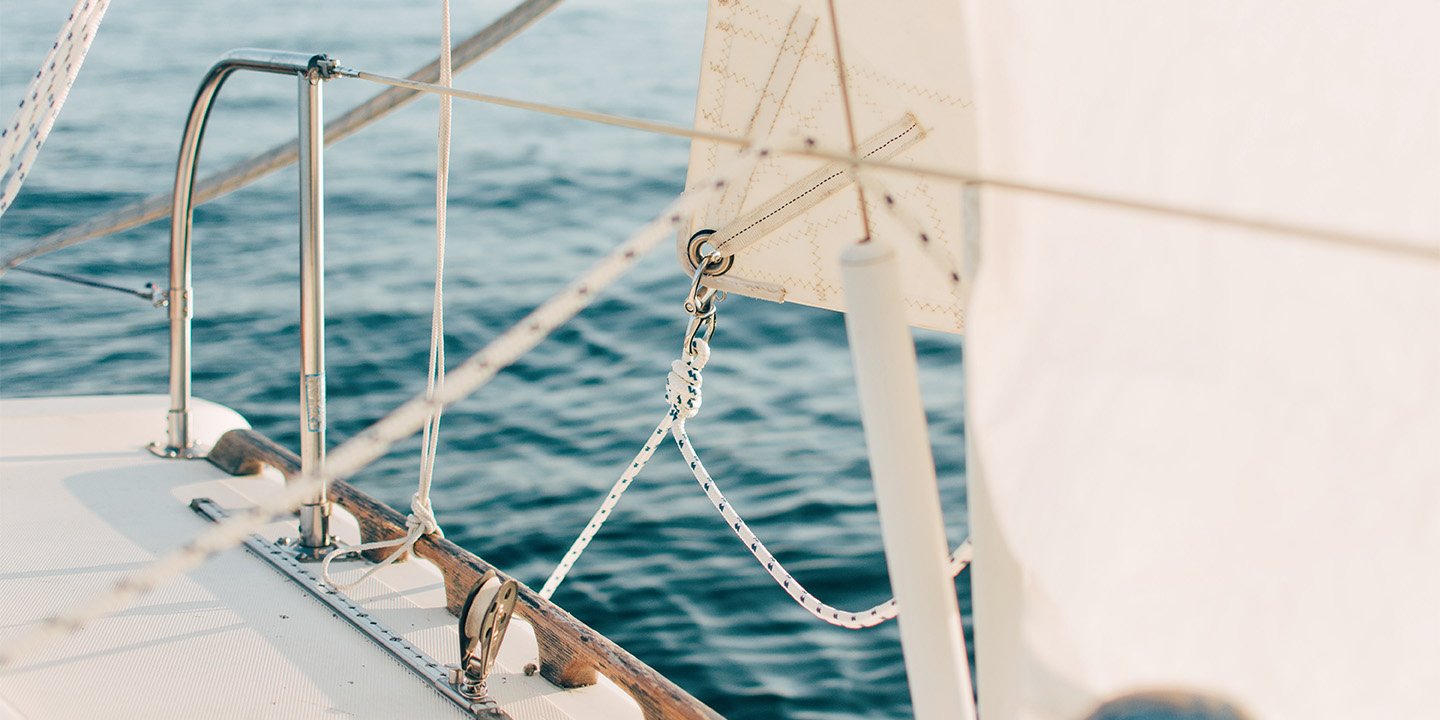 Close up of sailboat on the open ocean.