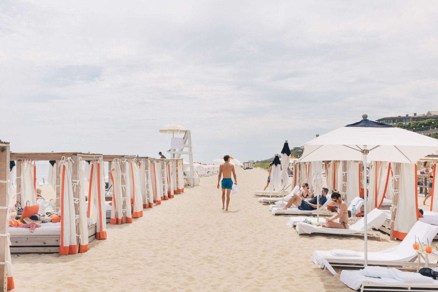 Man walking through Gurney's Montauk private beach.