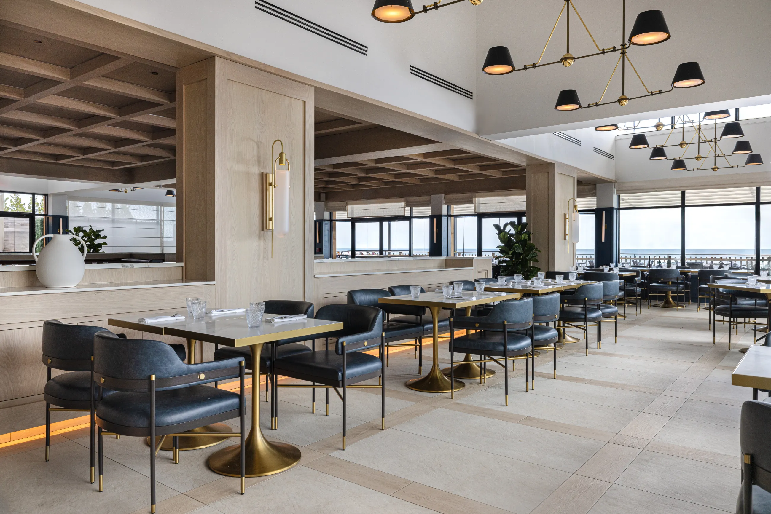 a wide dining area with tables and chairs