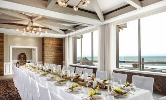Inside Banquet hall with chairs overlooking the ocean