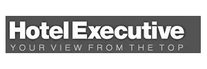 "Hotel Executive" logo with the tagline "Your View from the Top" in white text on a gray background.