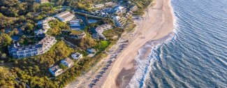 arial shot of the beach with waves