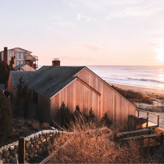 Sunset light reflecting off wooden building 