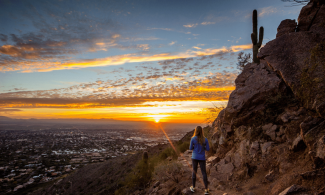 Woman hiking at sunset