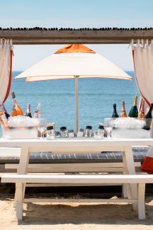 Montauk Beach Club table setup with champagne and wine.