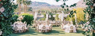 Wedding lawn set up for dinner reception with stunning mountain backdrop.