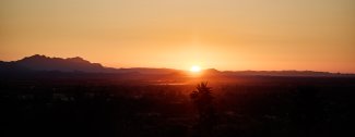 View of the sun rising over Paradise Valley.