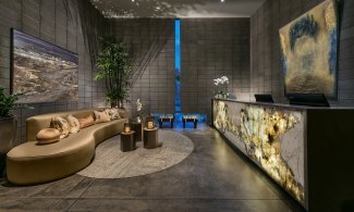 Sanctuary Spa lobby with decorative front desk and sitting area.