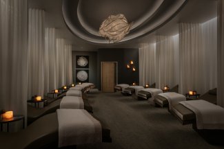 Sanctuary Spa quiet room with luxury lounge chairs and candles.