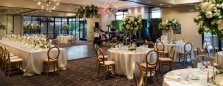 Views Ballroom set up for wedding reception with band stage and dance floor.