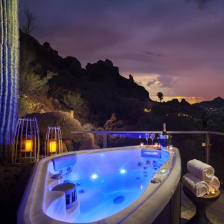 Villa Ventana private hot tub with bottle of champagne.