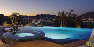 Villa Montana private pool and hot tub overlooking valley at dusk.