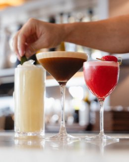 Various cocktails being garnished