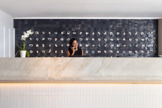 Front Desk lady on the phone 